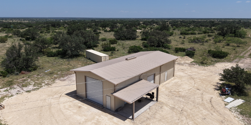 Exterior drone shot of metal building