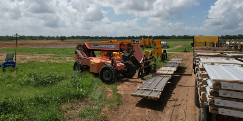Muleshoe Employees Delivering Steel Equipment Machines