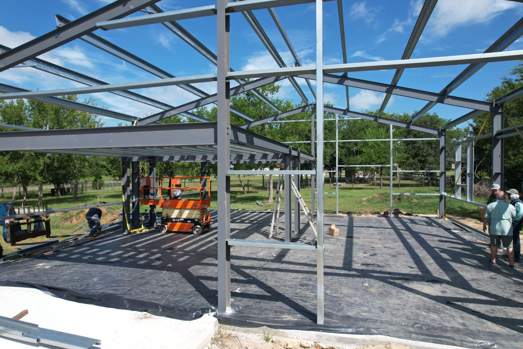 Steel frame erection of a 40x40x16 detached shop by Muleshoe Buildings in Bryan, TX