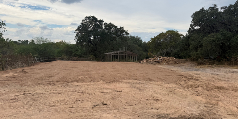 Site preparation and dirt work underway for a 30x60 agricultural storage barn construction project