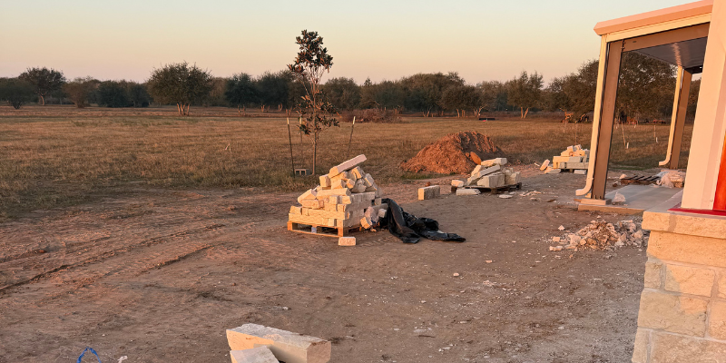 metal building construction in progress with materials on site showing phased building process and financing timing