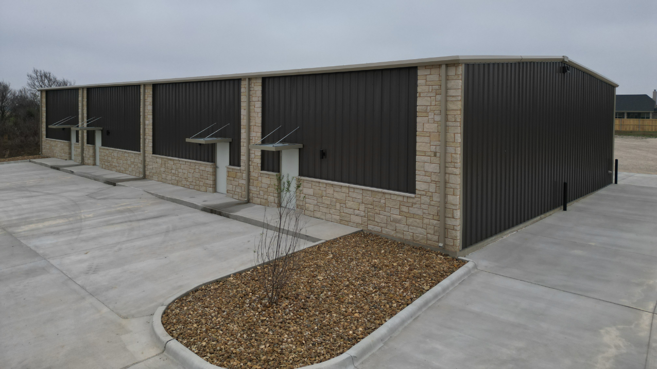 Side view of the 51x110 multi-unit commercial flex space metal building by Muleshoe Buildings in Bryan, TX
