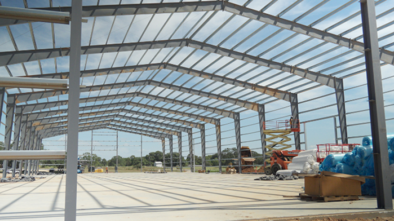 Steel frame and roof purlins under construction for a large metal building.