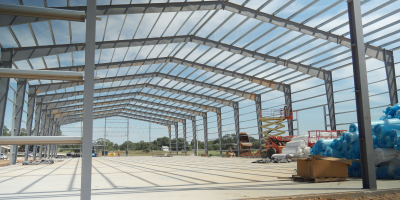 Steel frame and roof purlins under construction for a large metal building.