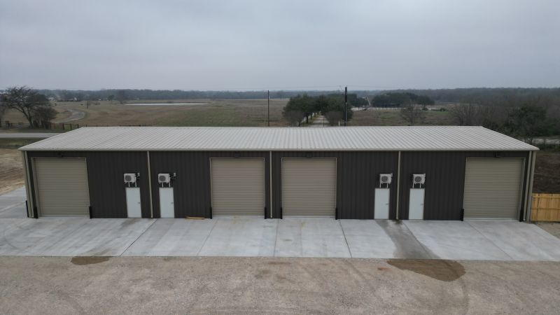 side view of commercial metal building showing divided layout and multiple entry points in Bryan Texas