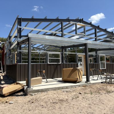 covered-porch-frame-on-ranch-barndominium