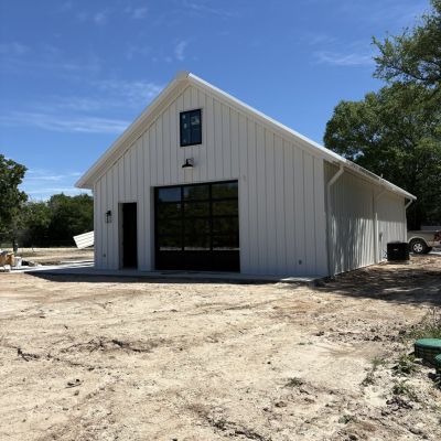 black-glass-garage-door-metal-building-anderson-tx