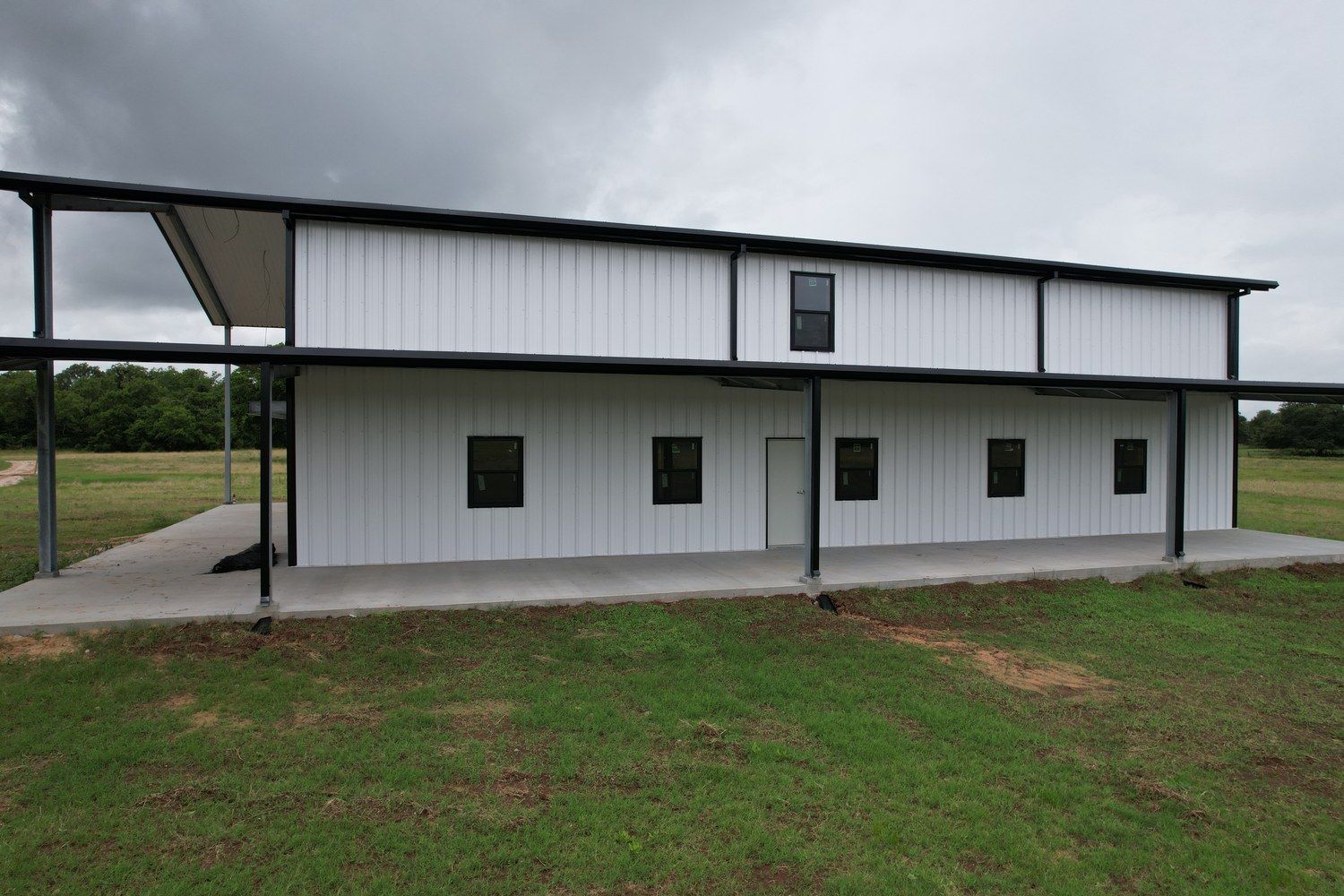brookshire-tx-ranch-retreat-metal-building-aerial