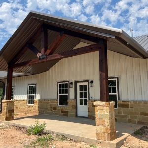 custom-metal-building-stone-wainscot-timber-entry-texas.jpg