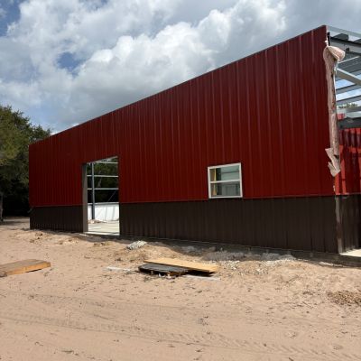 red-and-black-barndominium-wall-panel-installation