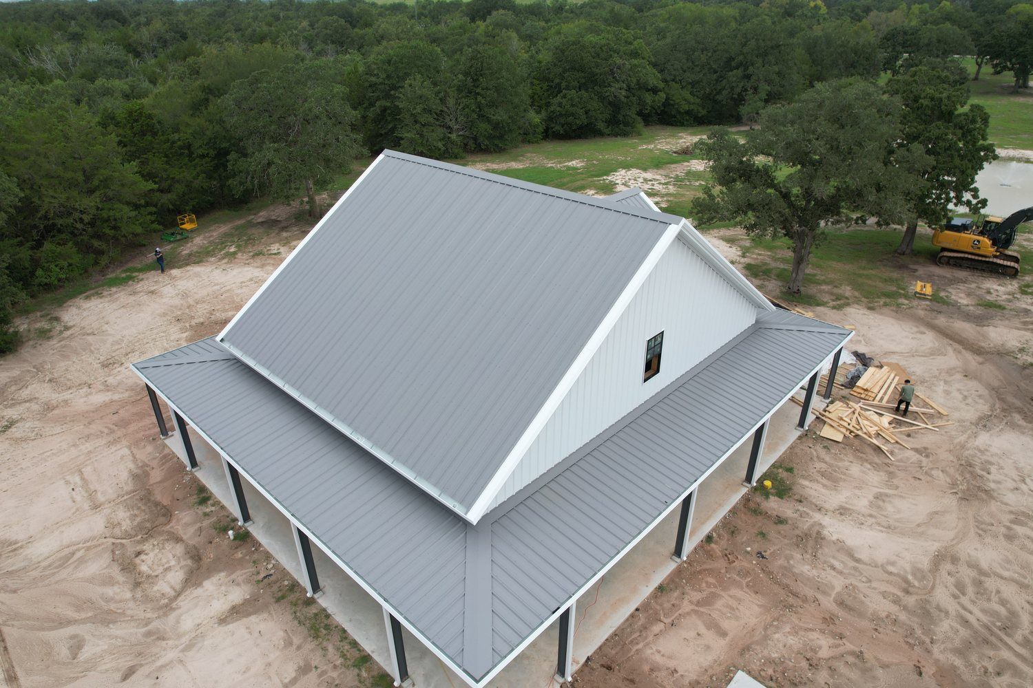 aerial-wraparound-porch-metal-home-brazos-valley