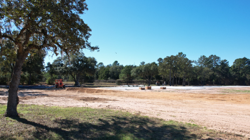 metal building site visit evaluating land grading and building pad layout