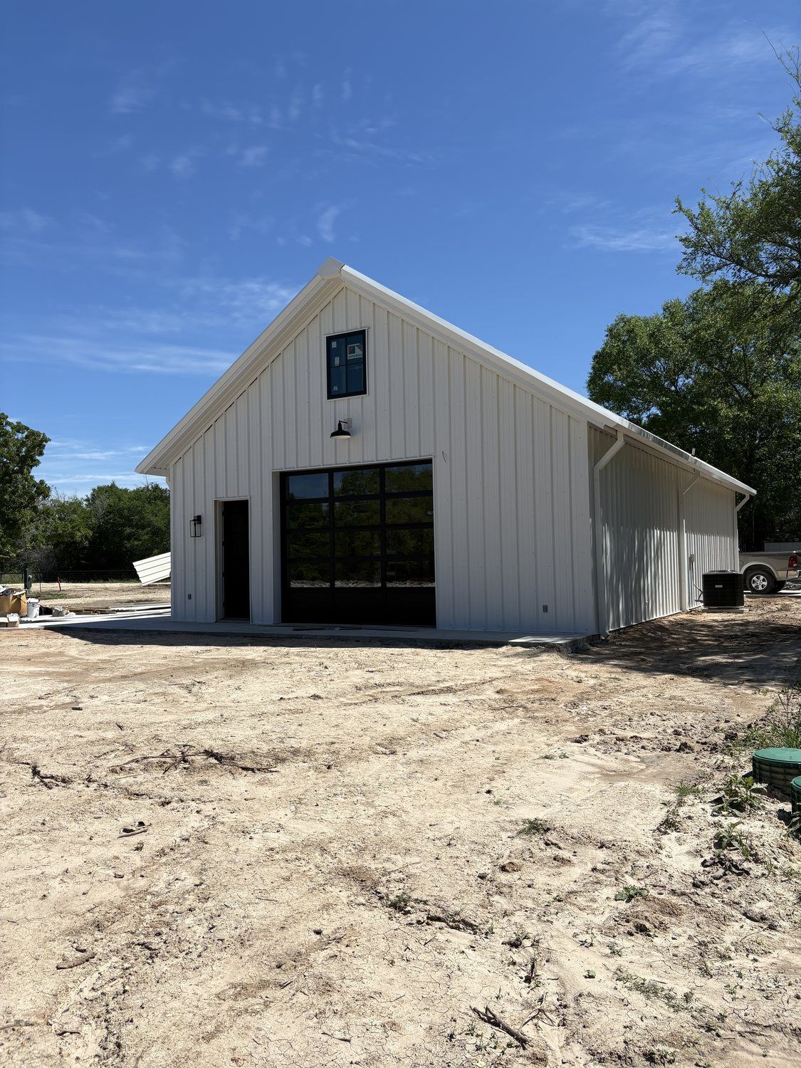 black-glass-garage-door-metal-building-anderson-tx