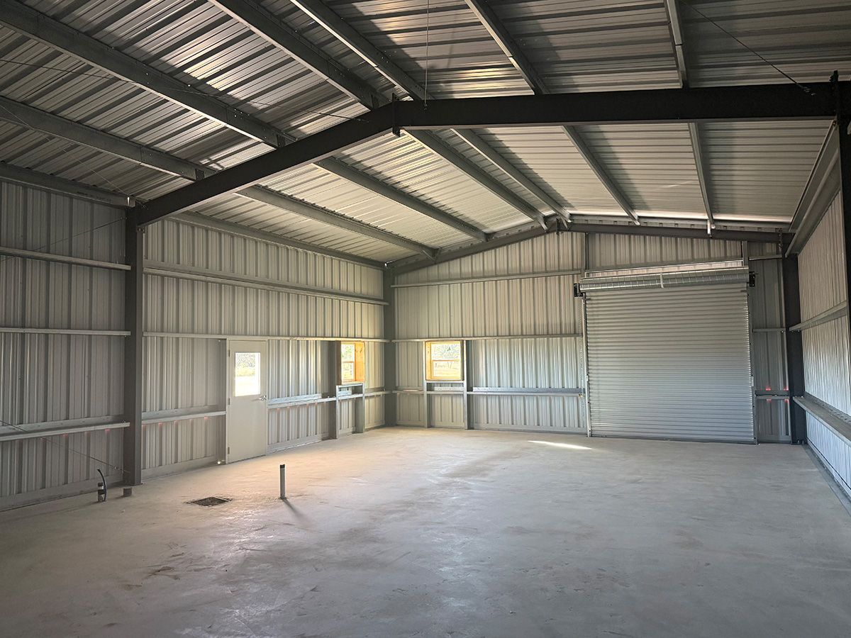30x50x14-barndominium-roll-up-door-front-view-columbus-tx-4