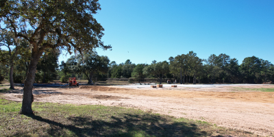 metal building site visit evaluating land grading and building pad layout