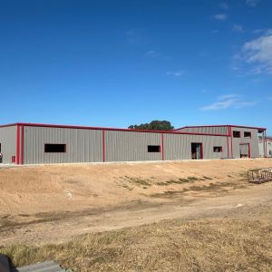 large-commercial-metal-building-red-trim-construction-texas