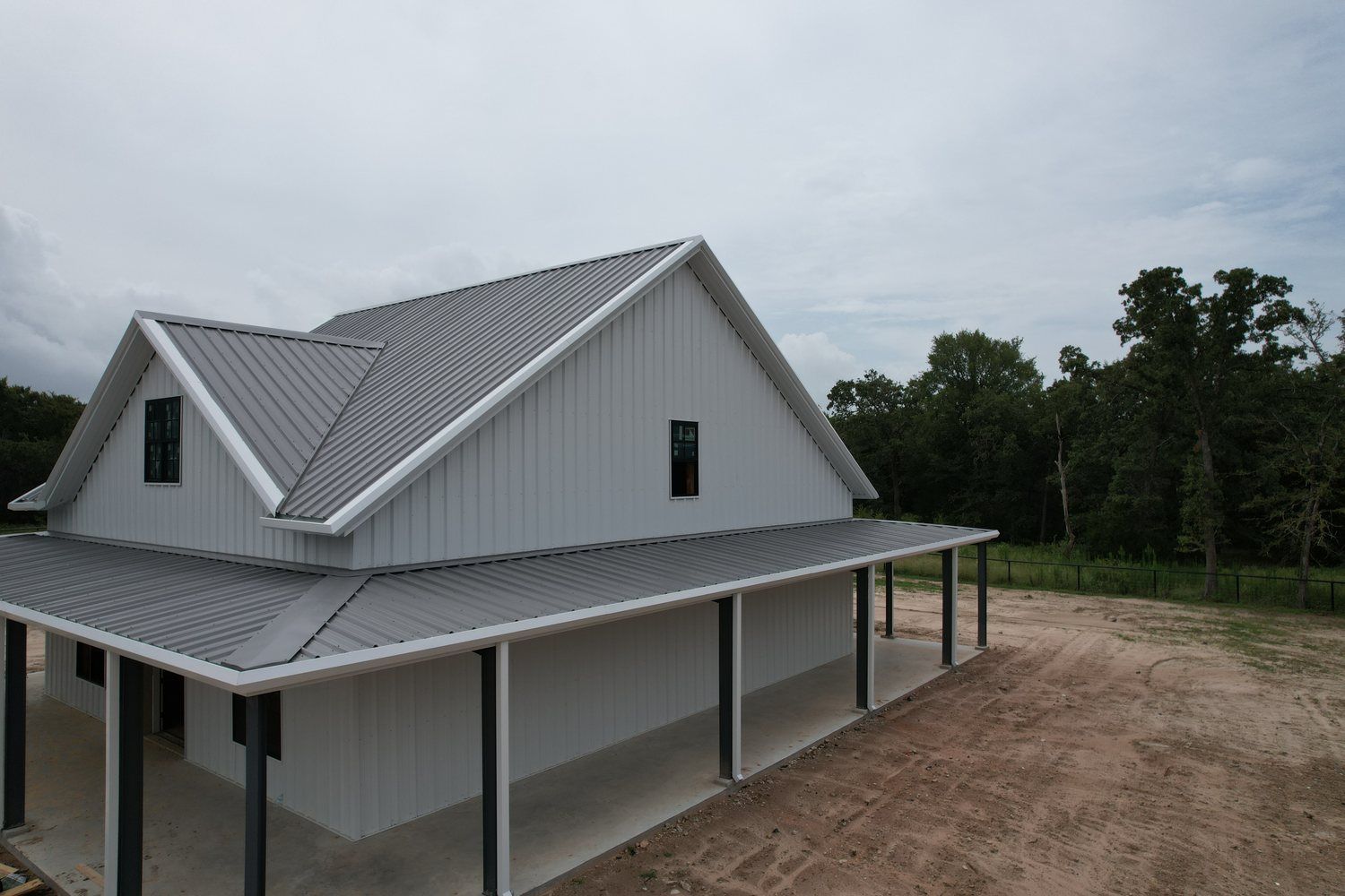 modern-metal-farmhouse-wraparound-porch-near-college-station-tx