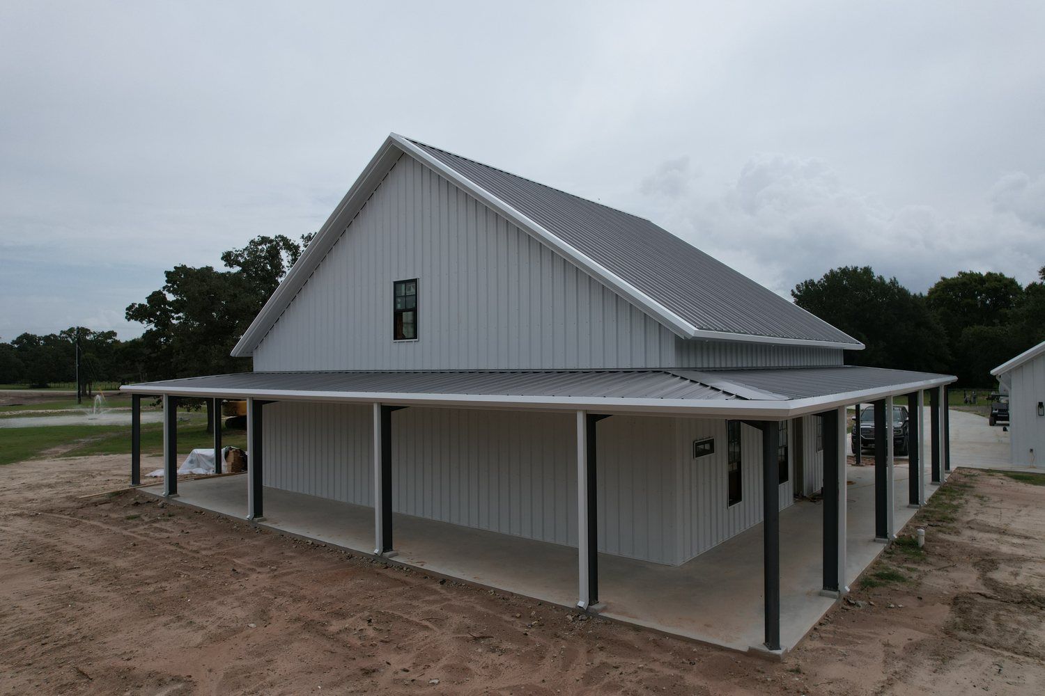 white-metal-farmhouse-covered-porch-near-college-station