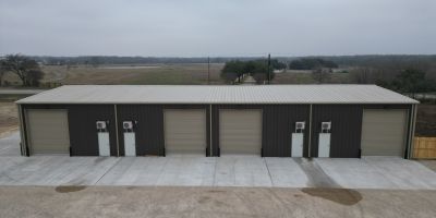side view of commercial metal building showing divided layout and multiple entry points in Bryan Texas