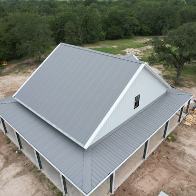 aerial-wraparound-porch-metal-home-brazos-valley