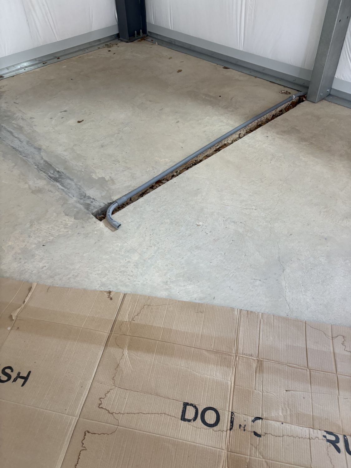 electrical-conduit-cut-into-barndominium-concrete-slab