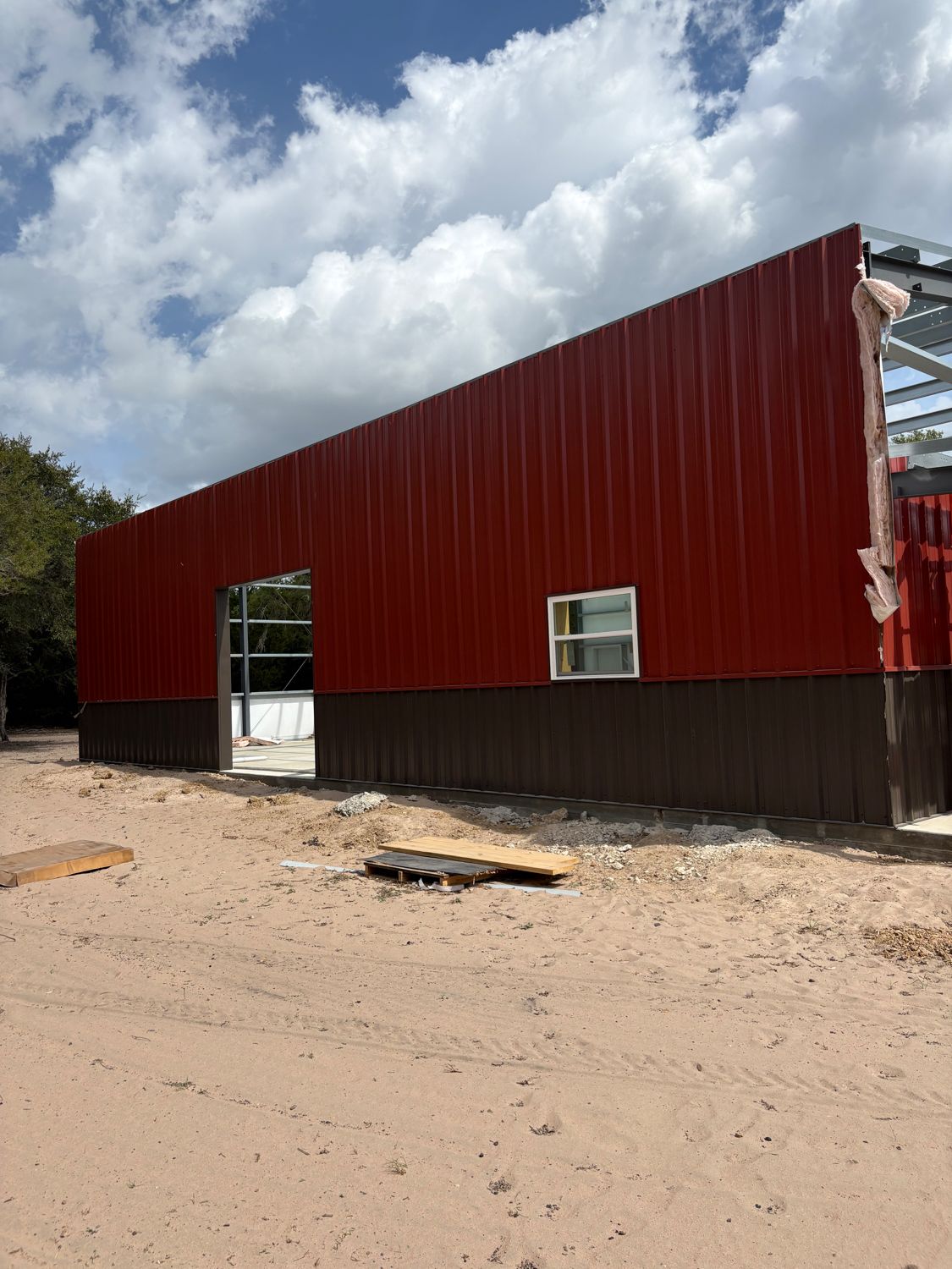 red-and-black-barndominium-wall-panel-installation