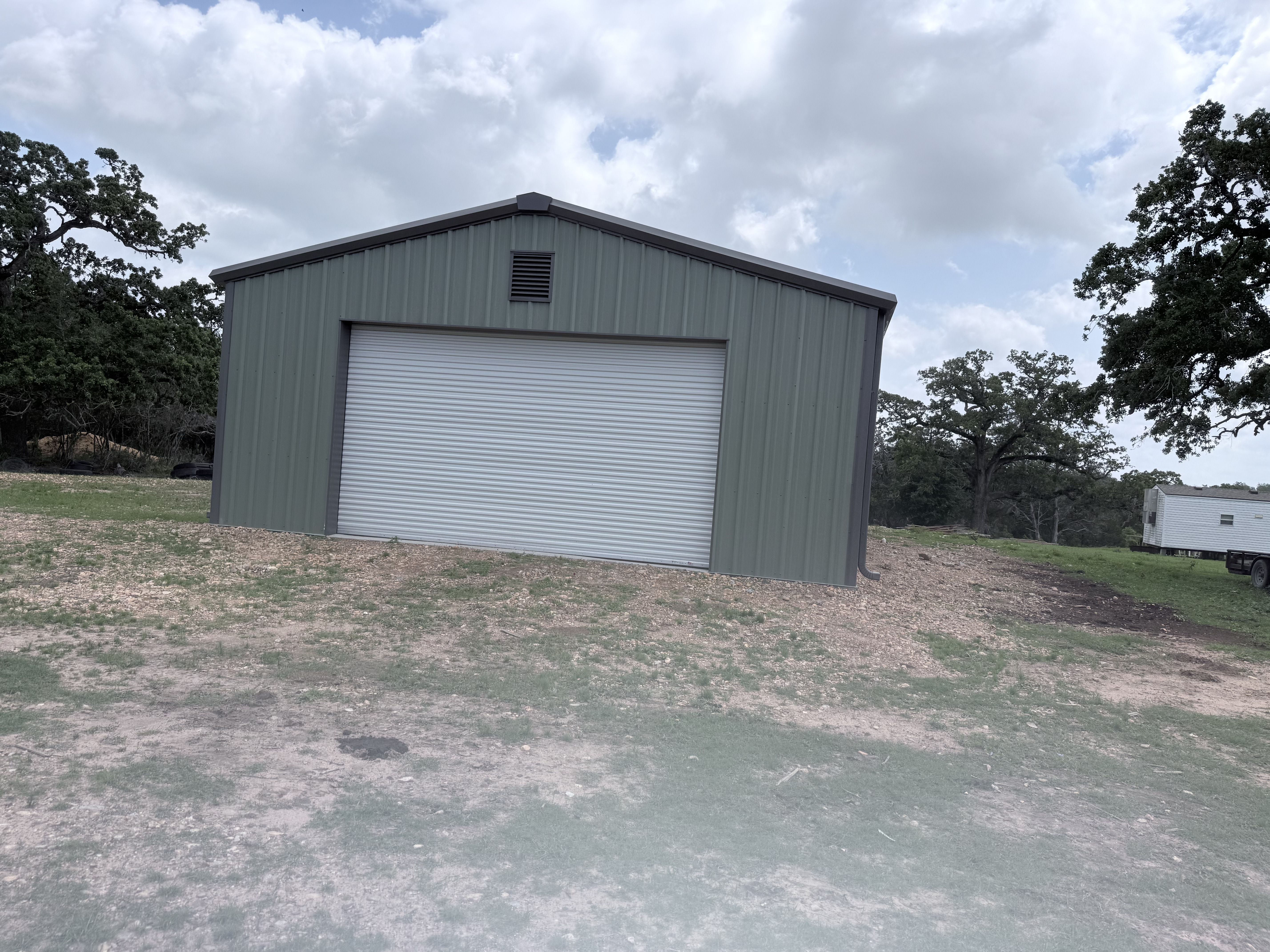 residential-barndominium-metal-building-roll-up-door-view2