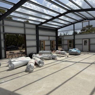 insulated-metal-building-interior-with-shop-door-opening